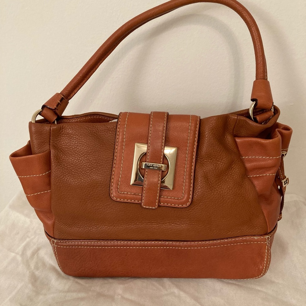 Kate Spade shoulder bag, light brown leather with gold colored closure.
